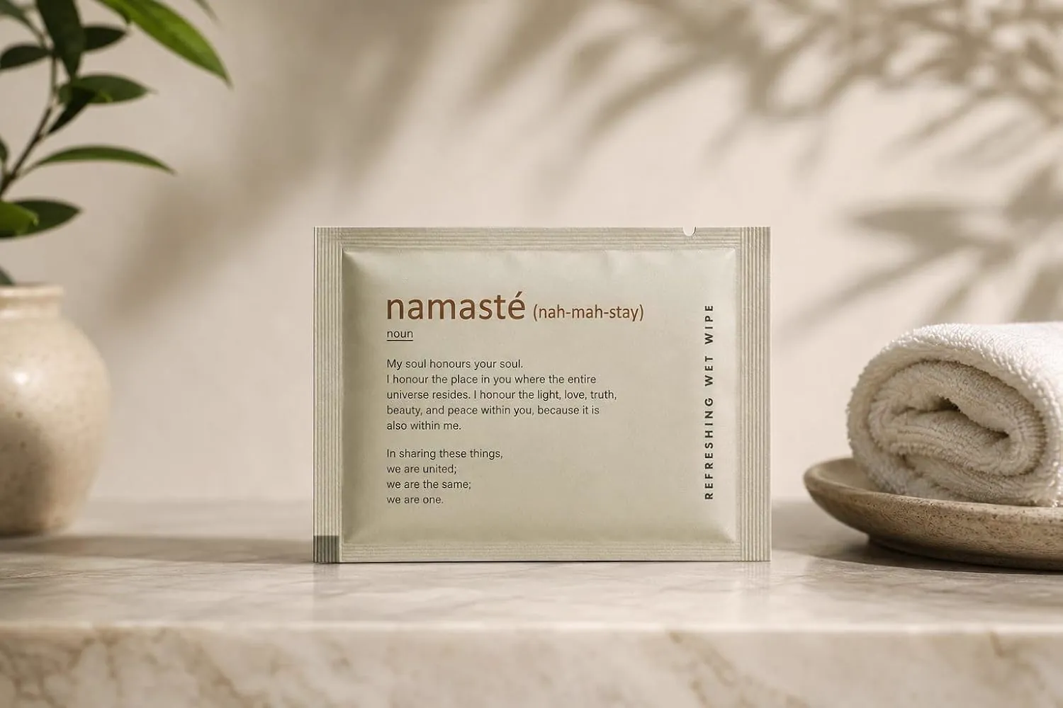 Namasté sachet on a marble counter beside a rolled towel